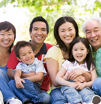 Happy family posing outdoors together